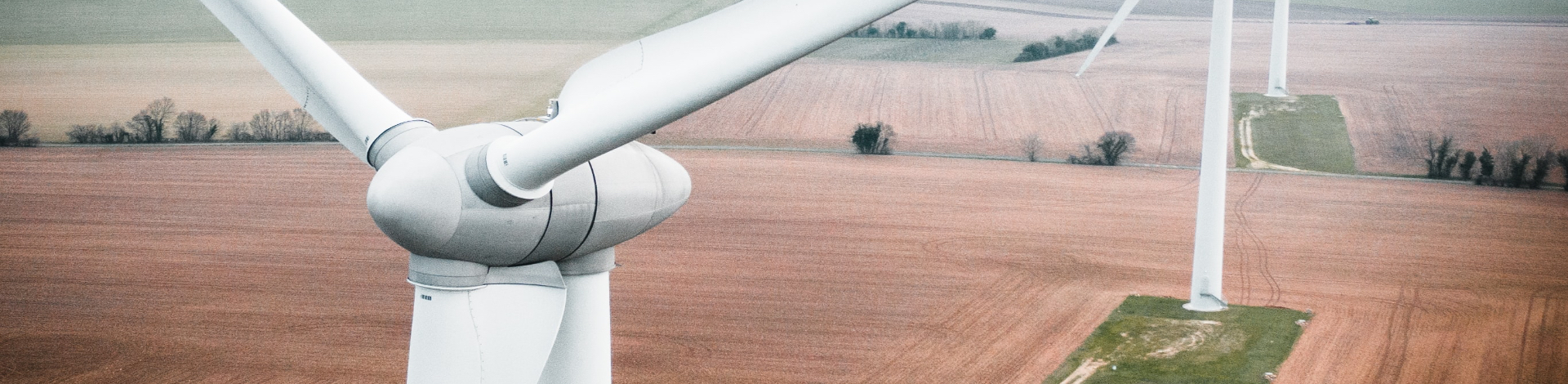 Birds eye view of a wind turbine and wind farm