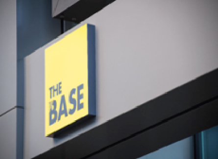 The Base logo on an exterior shot of the building.